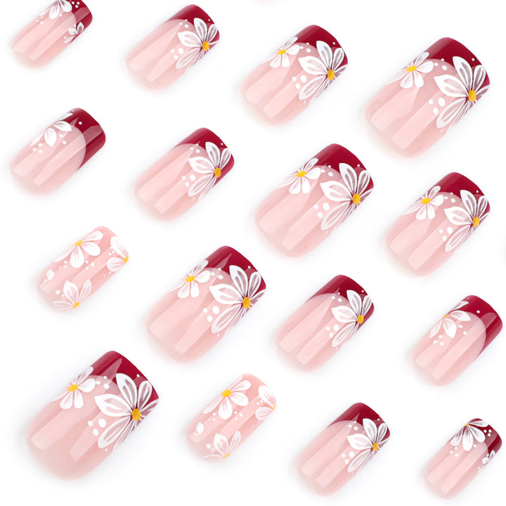 Kunstvolle Nagelverlängerungen mit Blumenmotiv Karnz