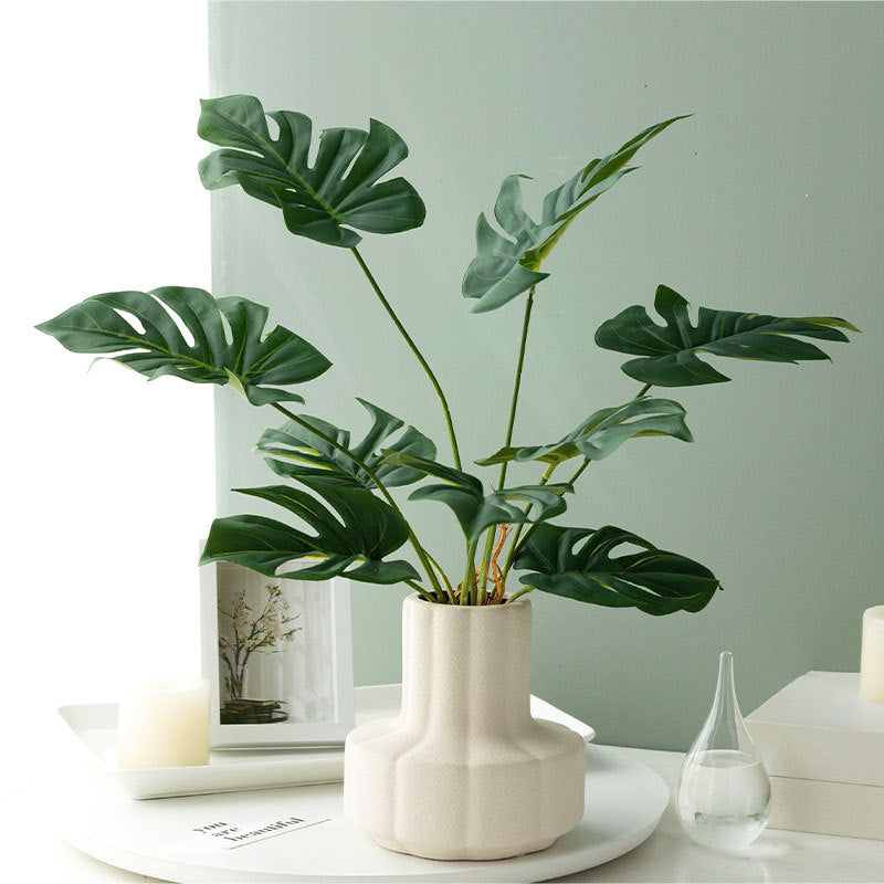 Dekorative Monstera Blatt Pflanzenanordnung für Zuhause