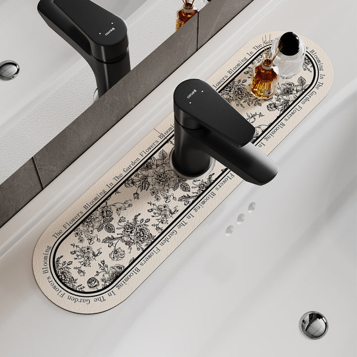 Decorative Oval Silicone Faucet Splash Guard Mat with Floral Engraved Print and Non-Slip Backing