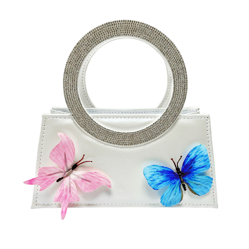 Künstlerische mit Schmetterlingen verzierte Handtasche