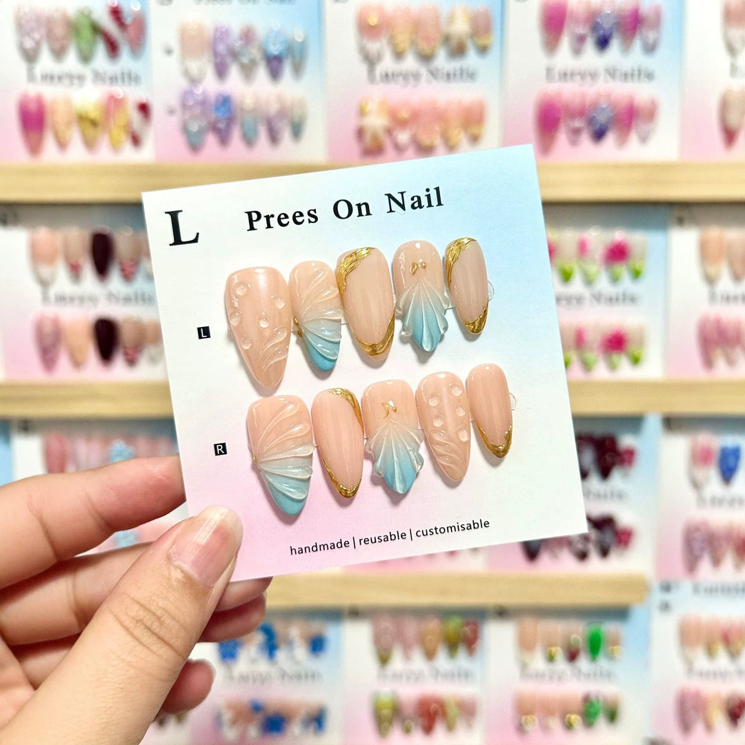 Künstlerisches Press-On-Nagelset mit Muschelmotiven