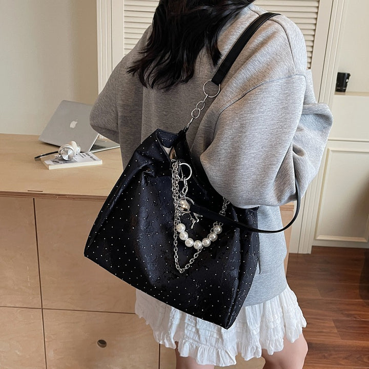 Elegante Handtasche mit Perlendetails Karnz