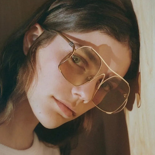 Damen geometrische Sonnenbrille mit schmalem Metallrahmen und braunen Gläsern Karnz