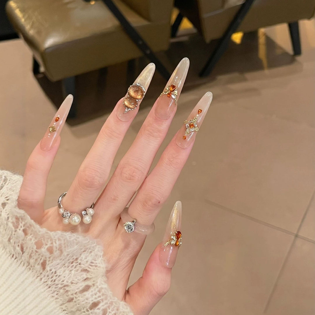 Dekorativer Stiletto Press-On Nagelset mit Edelsteinakzenten Karnz 1788224085