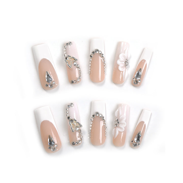 Kunstnagelset mit eleganten Glitzer- und Blütenmotiven Karnz