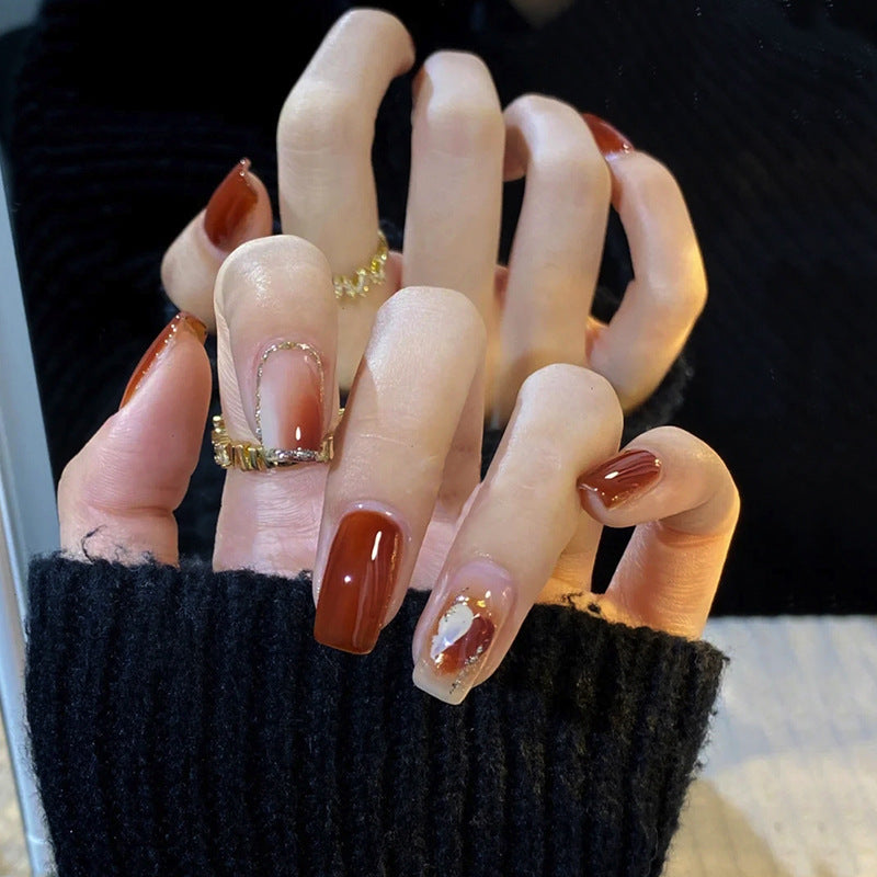 Elegante glänzende Press-On Nägel mit goldenen Glitzerakzenten Karnz