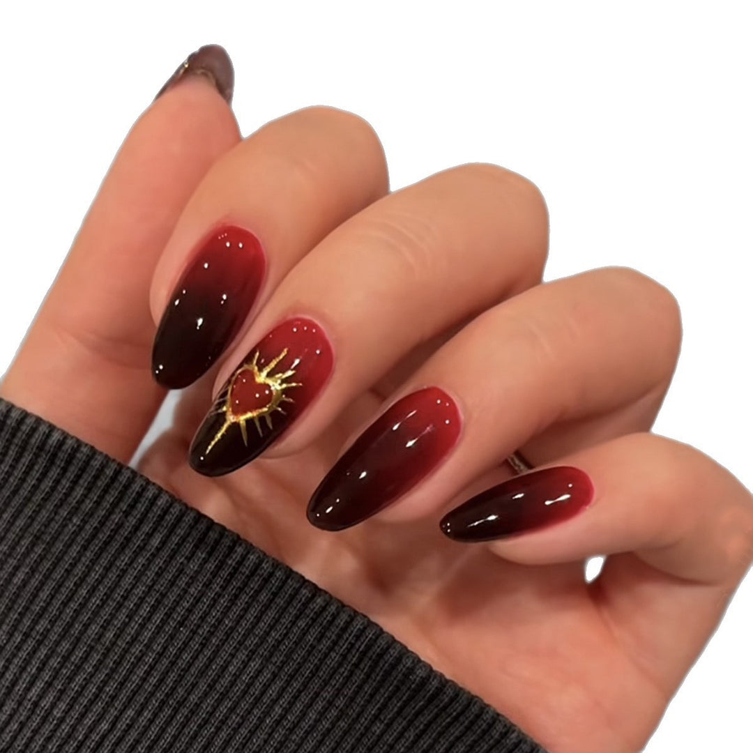 Kunstnagelset mit glamourösem Herz- und Sonnenmotiv Karnz