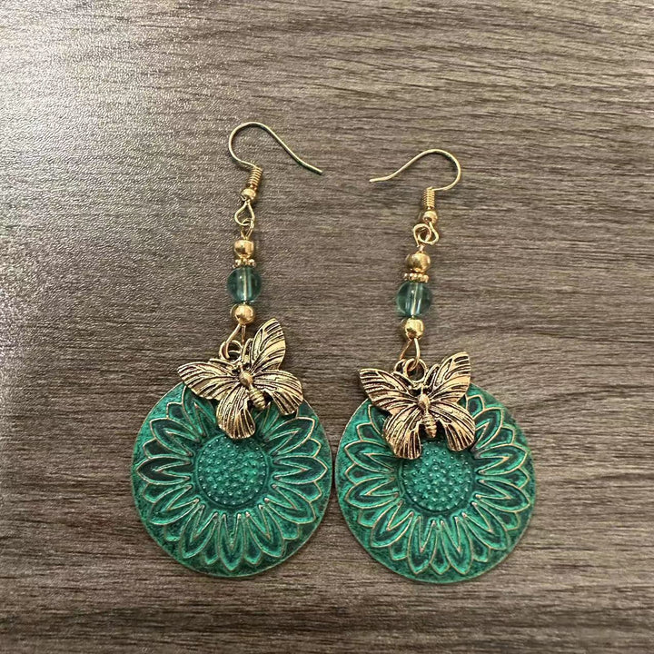 Elegante Ohrhänger mit Blumenmotiv und Schmetterlingen Karnz
