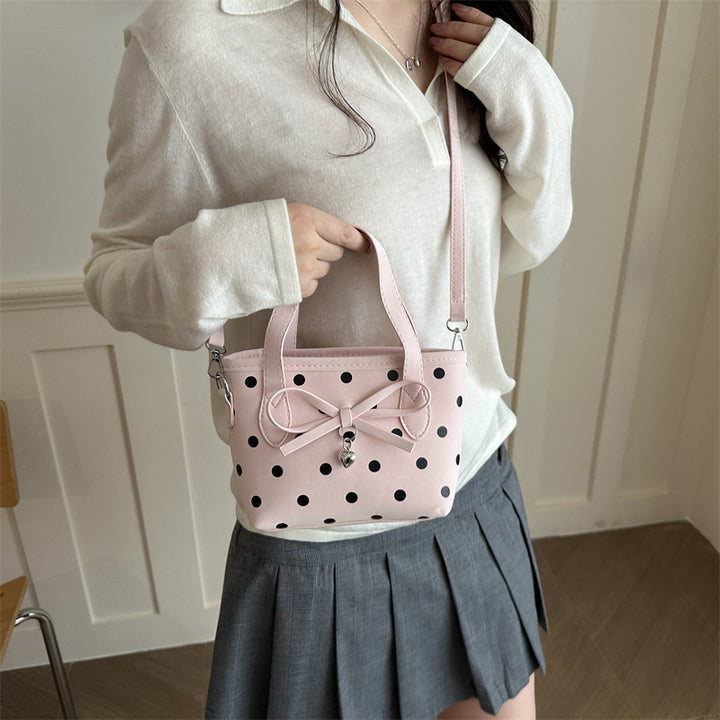 Charmante gepunktete Mini-Handtasche