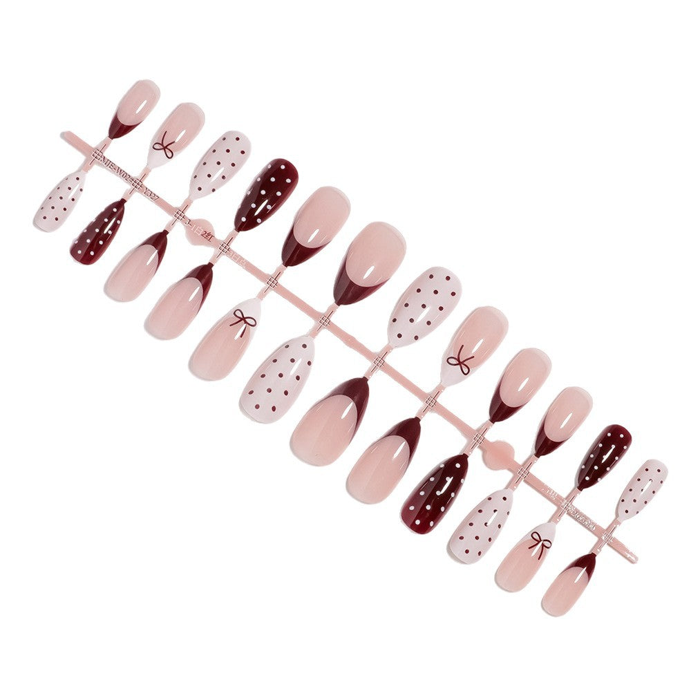 Künstlerisches Press-On-Nagelset mit Schleifen- und Punktdesign Karnz