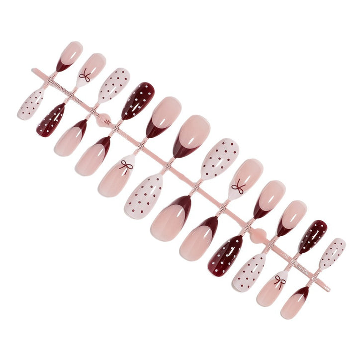 Künstlerisches Press-On-Nagelset mit Schleifen- und Punktdesign Karnz