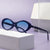 Damen stilvolle Sonnenbrille im ovalen Design Karnz