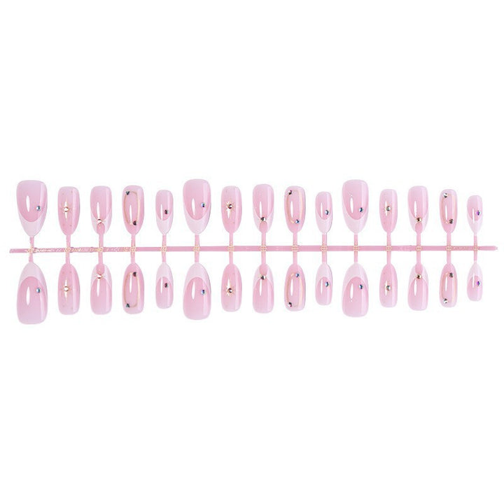 Kunstnagelset mit elegantem Spitzen-Design und glamourösen Akzenten Karnz