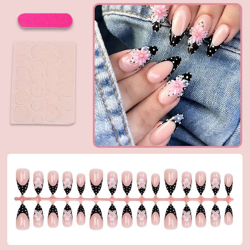 Kunstnagelset mit eleganten 3D-Blumen und stilvollen Punkten Karnz