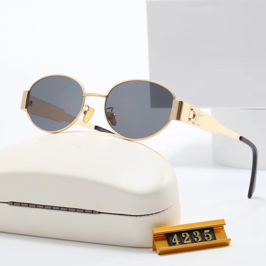 Damen elegante ovale Sonnenbrille mit goldfarbenem Rahmen Karnz