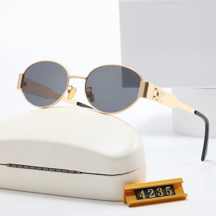 Damen elegante ovale Sonnenbrille mit goldfarbenem Rahmen Karnz