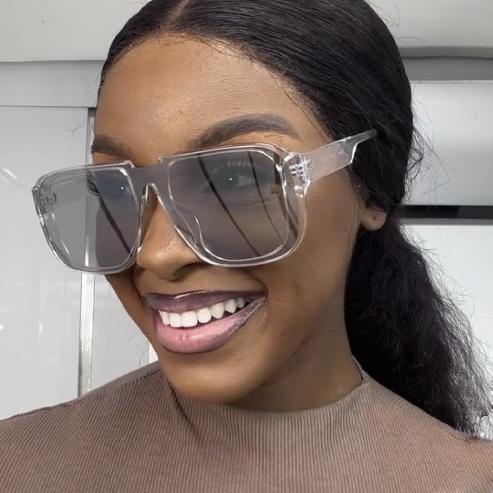Damen trendy quadratische Sonnenbrille mit transparentem, grünem Rahmen und schützendem UV-Filter Karnz