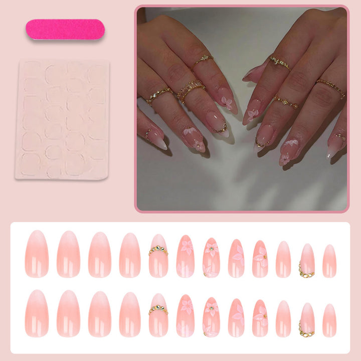 Kunstnagelset mit romantischen Blüten- und Glitzerakzenten Karnz