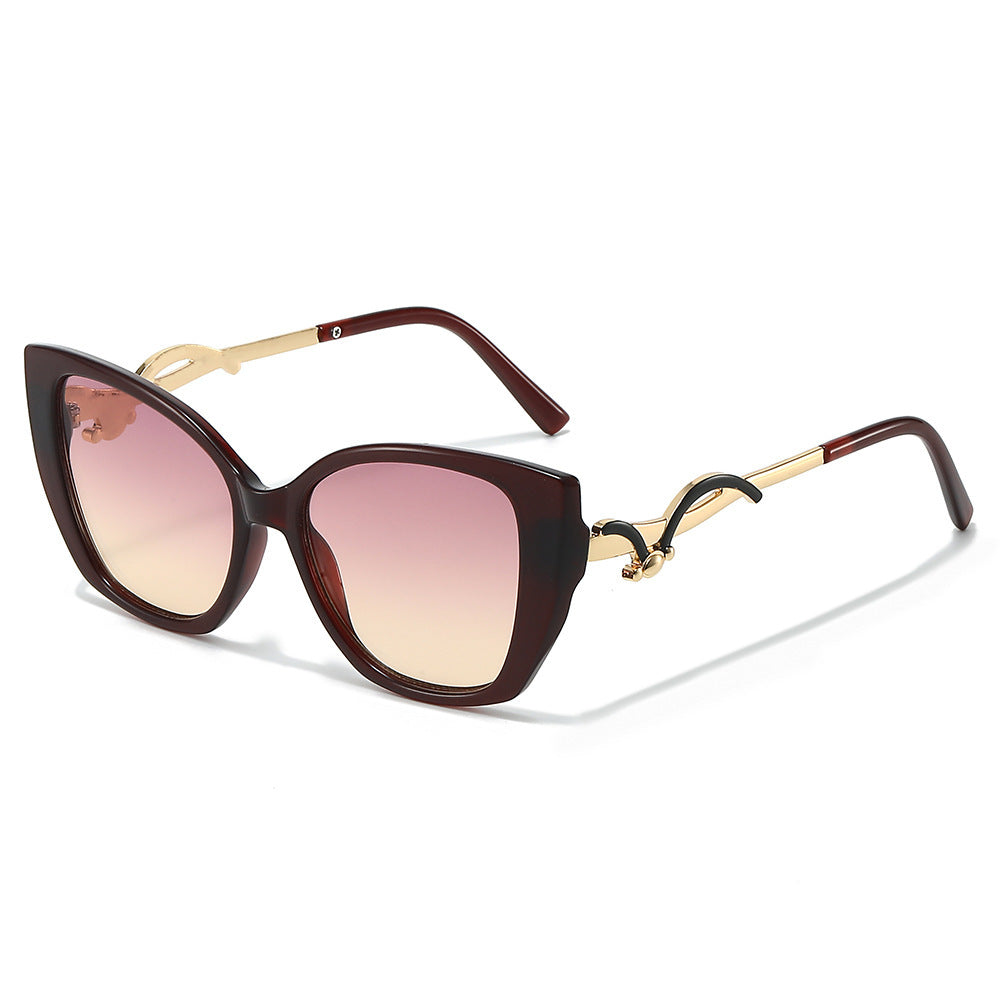 Übergroße Geometrische Katzenaugen-Sonnenbrille mit goldenen Akzenten Karnz