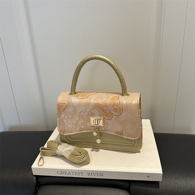 Elegante blumengemusterte Abendhandtasche