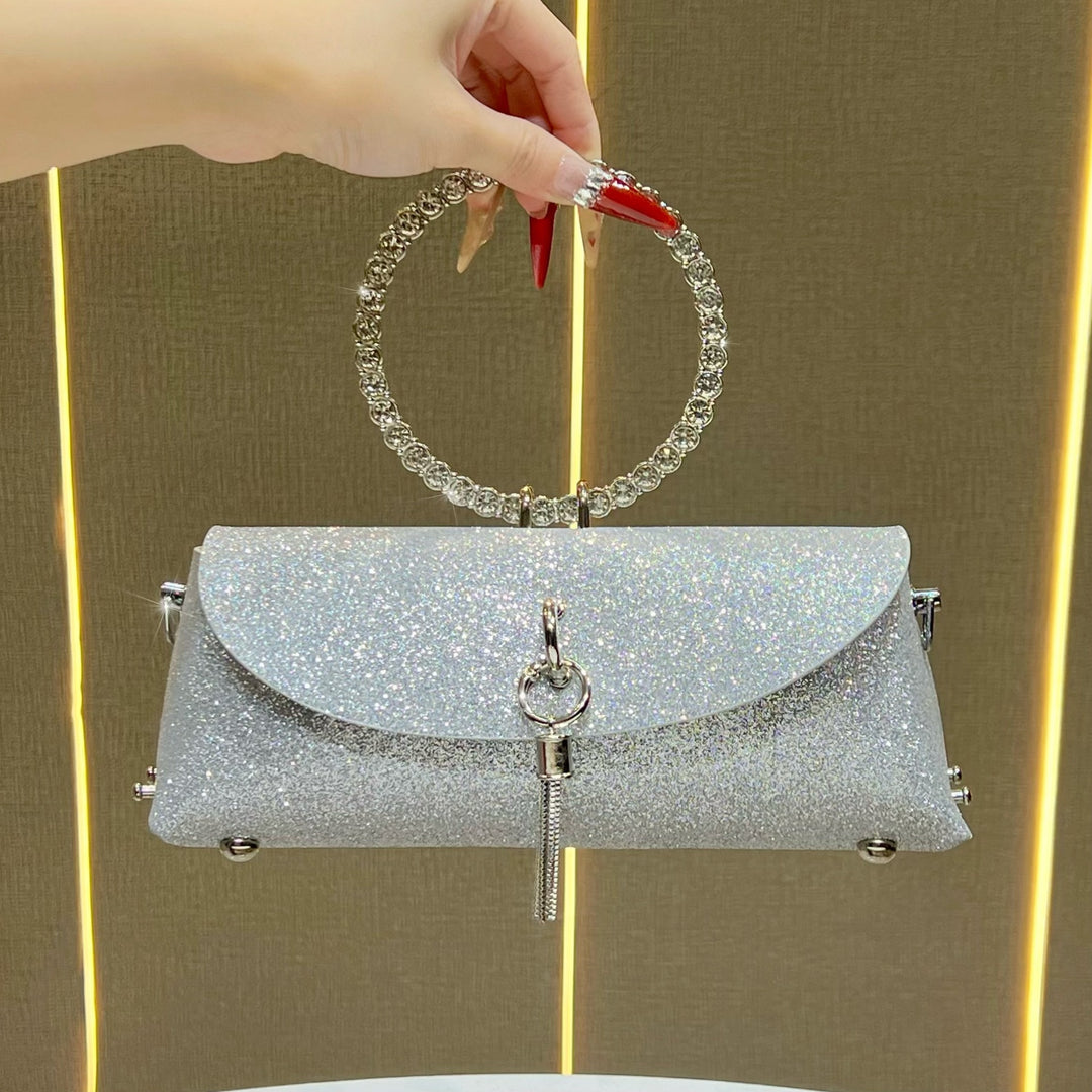 Glitzernde Clutch mit Strassgriff für den Abend