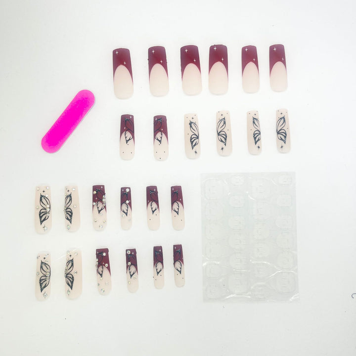 Künstlerische Lange Nagelverlängerungen mit Schmetterlingsdesign Karnz