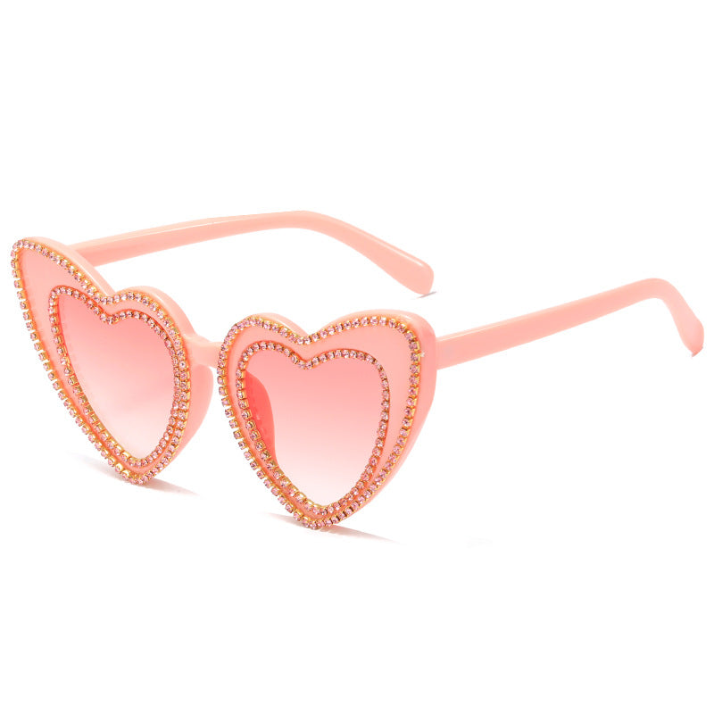 Damen Herzförmige Sonnenbrille mit Glitzerakzenten Karnz
