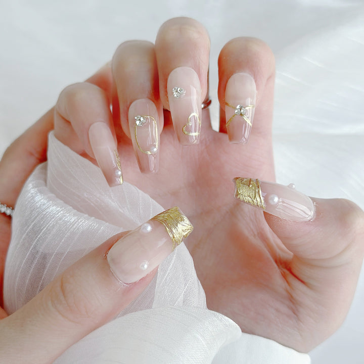 Elegante Ombre Press-On Nägel mit perlmuttfarbenen und goldenen Akzenten