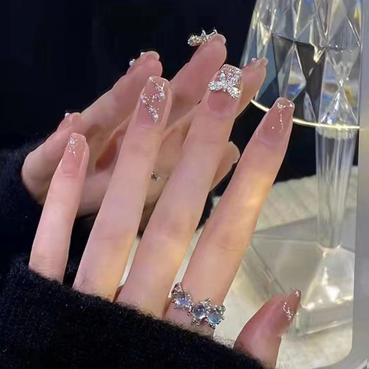 Glamouröse Glitter-Kunstnägel mit Schmetterlingselement Karnz