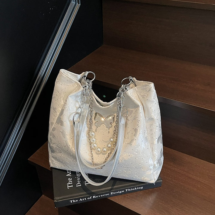 Elegante Handtasche mit Perlendetails Karnz