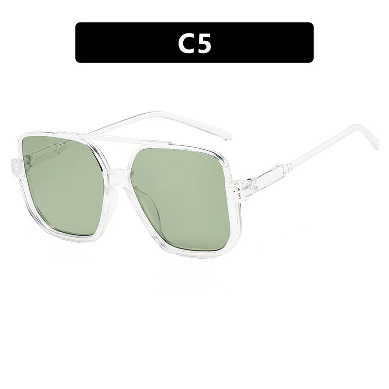 Damen quadratische Sonnenbrille mit transparentem Rahmen und grün getönten Gläsern Karnz