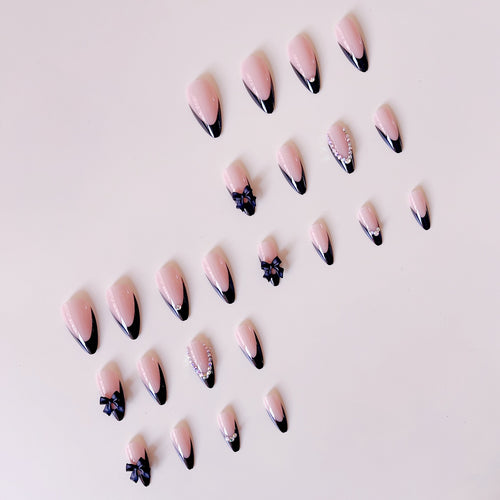 Kunstnagelset mit glamourösen 3D-Schleifen und Strassverzierungen Karnz