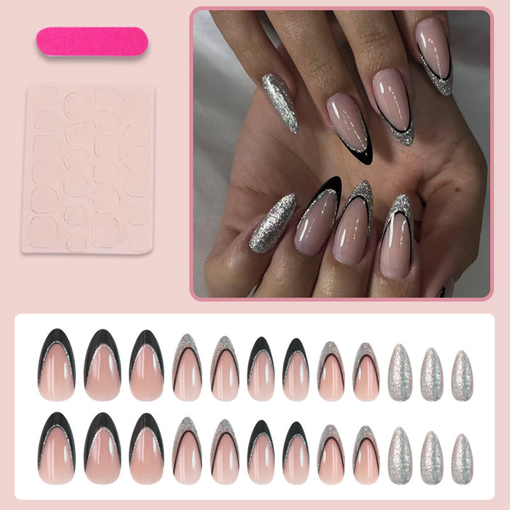 Kunstnagelset mit glamourösen Glitzerakzenten und elegantem Schwarz Karnz
