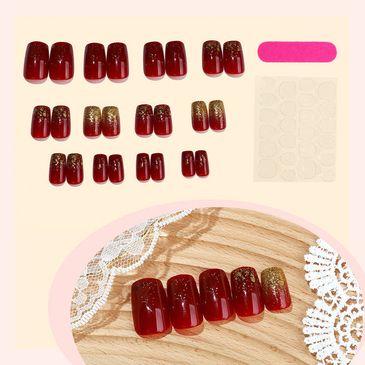 Elegantes Press-On Nagelset mit glamourösen goldenen Glitzerakzenten Karnz