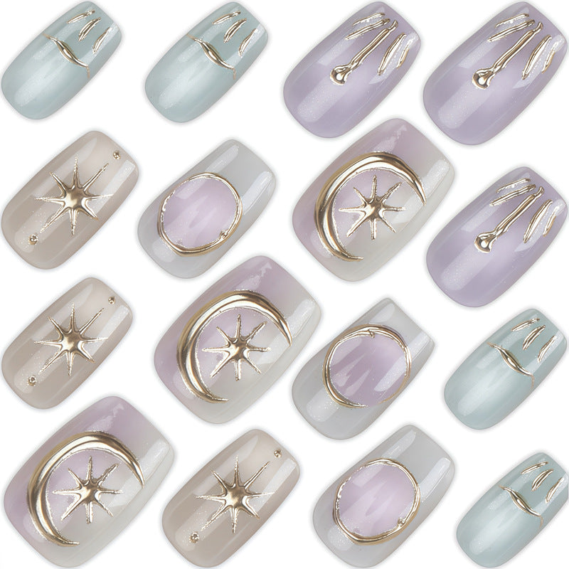 Künstlerisches Press-On Nagelset mit dekorativen himmlischen Designs Karnz