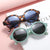 Damen modische Sonnenbrille im stilvollen runden Design Karnz