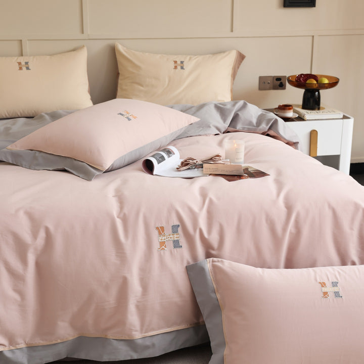 Zweifarbiges Luxus-Baumwoll-Percale-Bettwäsche-Set mit wendbarem Finish und besticktem Monogramm