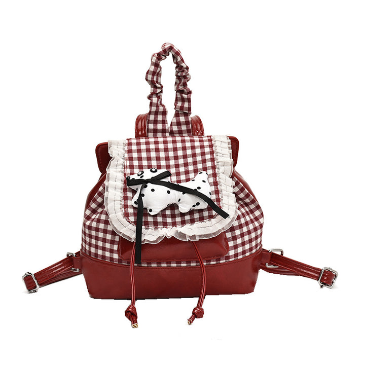 Verspielter Rucksack mit Karomuster und Tierapplikation Karnz