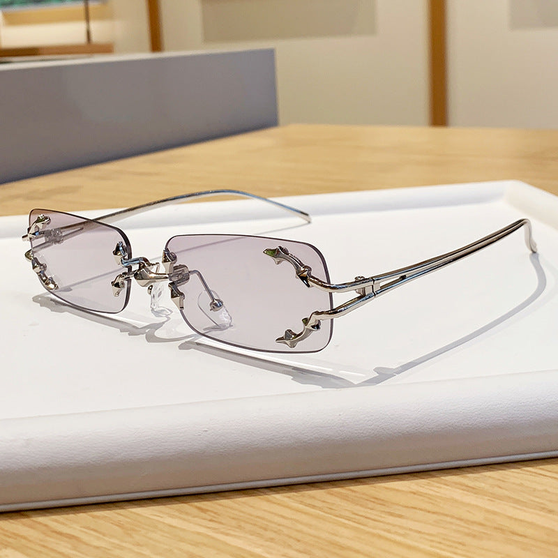 Damen modische Sonnenbrille mit filigranem Metallrahmen und transparenten Gläsern Karnz