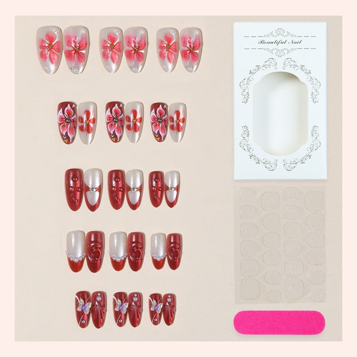 Kunstnagelset mit floralen Designs und Glitzerelementen Karnz