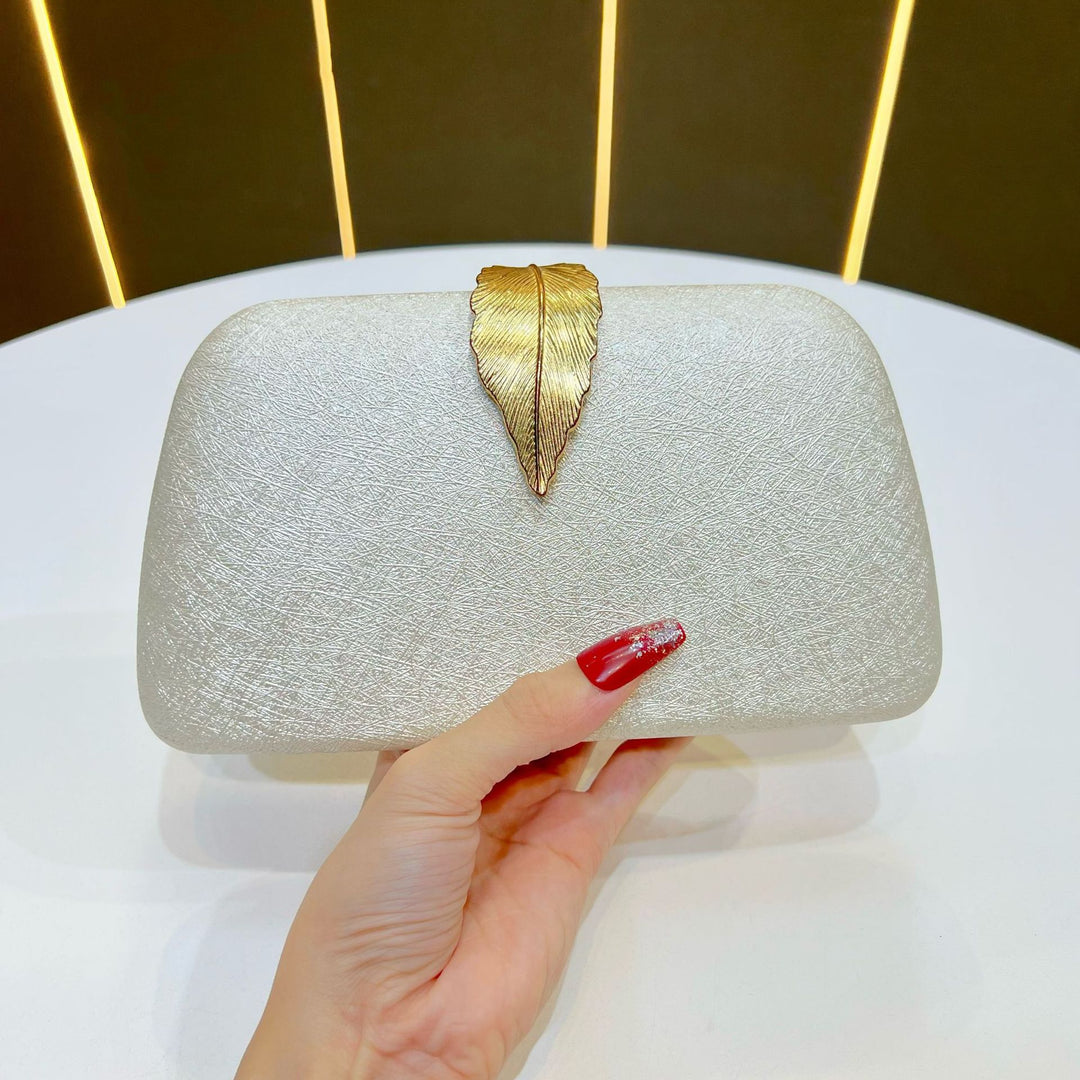 Elegante abendhandtas mit Blattakzenten