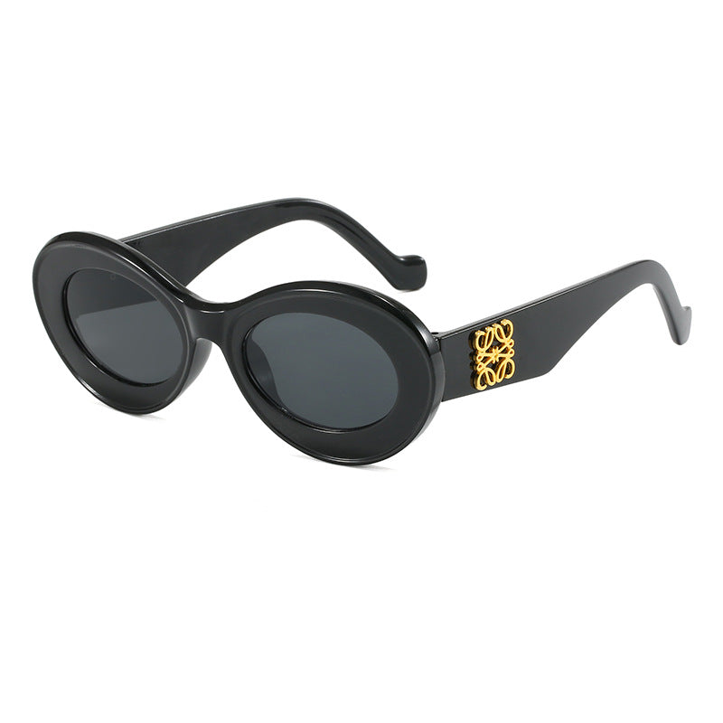 Damen modische Sonnenbrille mit ovalem Rahmen und goldenen Applikationen Karnz