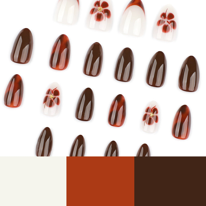 Kunstvolle Nagelverlängerungen mit eleganten floralem und glanzvollem Design Karnz