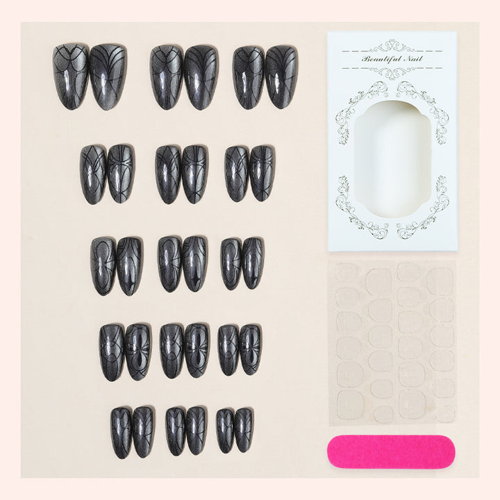 Dekorativer Presse-on-Nagelset mit künstlerischem Spinnendesign Karnz