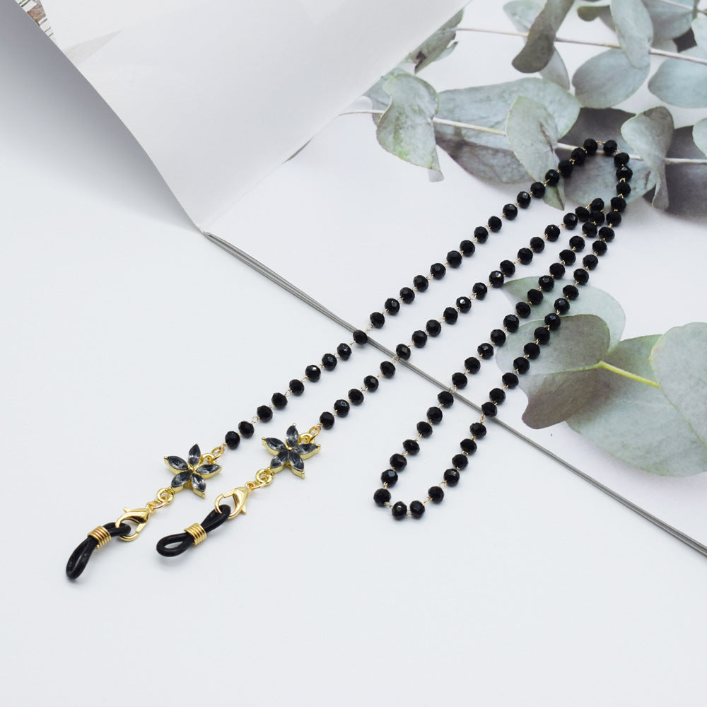 Eleganter mit Blumenakzenten verzierter Brillenketten Karnz