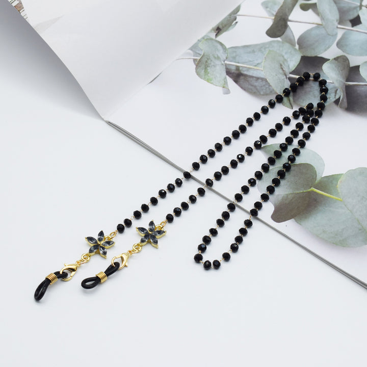 Eleganter mit Blumenakzenten verzierter Brillenketten Karnz