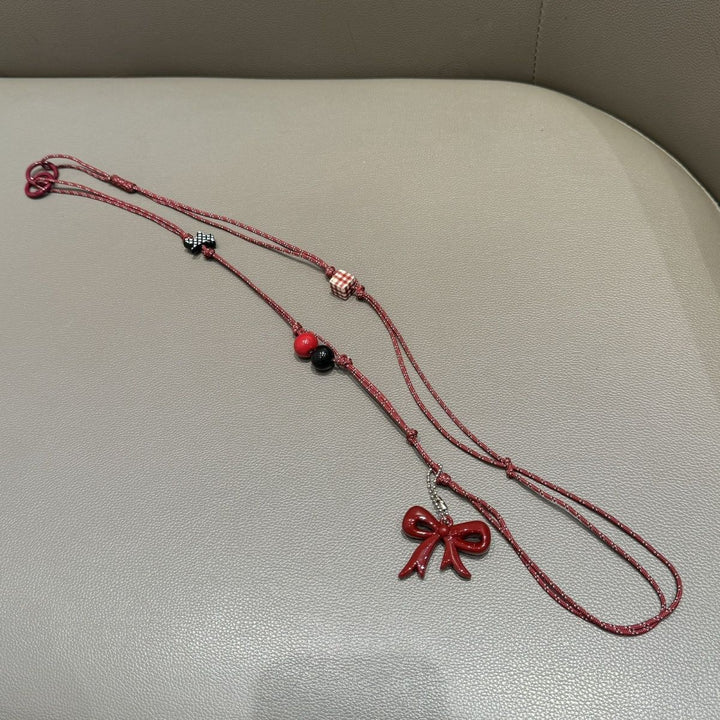 Verspielter Perlen Charm Brillenhalter Karnz