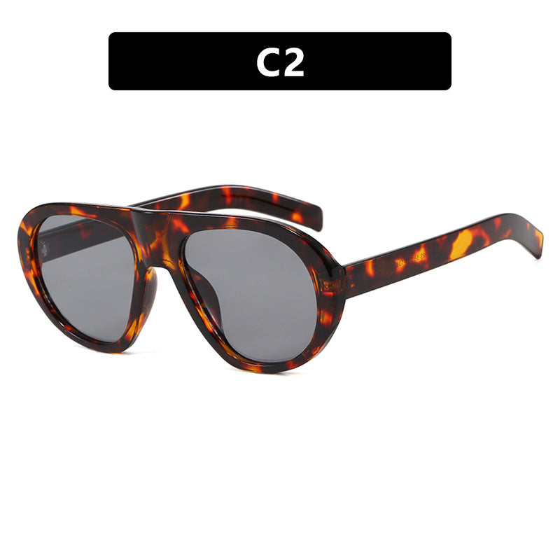 Damen auffällige Sonnenbrille mit futuristischem Rahmen und robustem Design Karnz