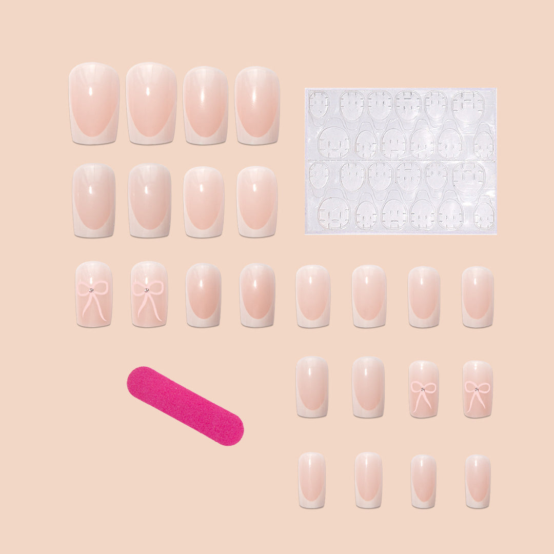 Kunstnagelset mit eleganten Schleifen- und Glitzerakzenten Karnz