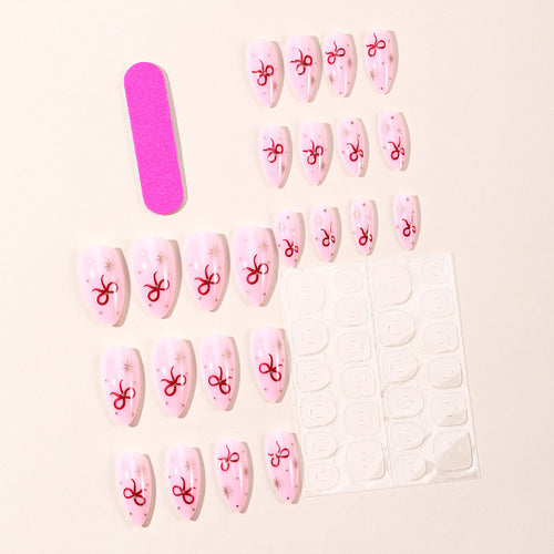 Stiletto-Nail-Art-Extensions mit Schleifenakzenten Karnz